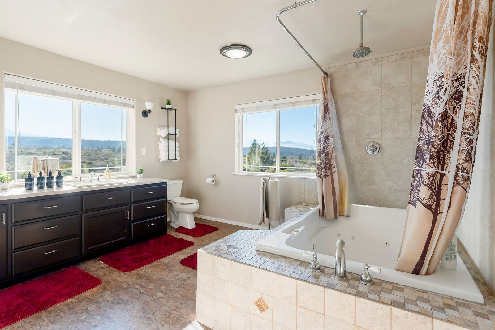 Master bathroom with jacuzzi tub and mountain views
